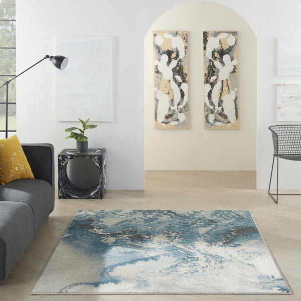HomeRoots 5' Modern Teal and Ivory Abstract Area Rug - Stylish, Non-Skid, Stain-Resistant for High-Traffic Spaces 4' X 6' 553216