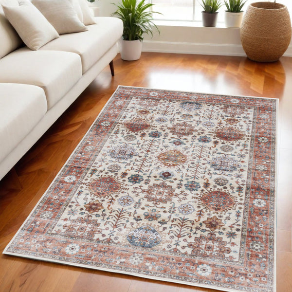 Homeroots 5' X 7' Beige And Orange Oriental Distressed Non Skid Area Rug  Polyester 553233