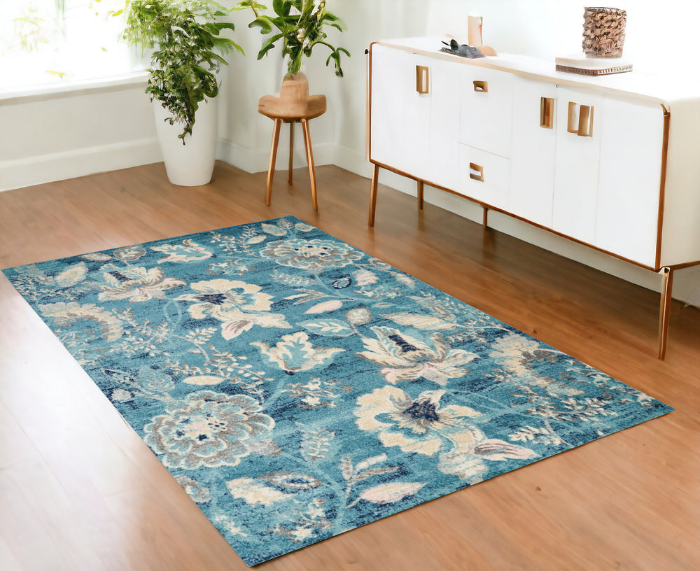 Homeroots 6' Stunning Turquoise Cream & Navy Floral Distressed Area Rug - Durable, Stain Resistant Design! 4' X 6' Polypropylene 553260