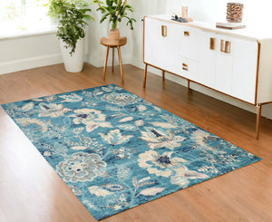 Homeroots 6' Stunning Turquoise Cream & Navy Floral Distressed Area Rug - Durable, Stain Resistant Design! 4' X 6' Polypropylene 553260