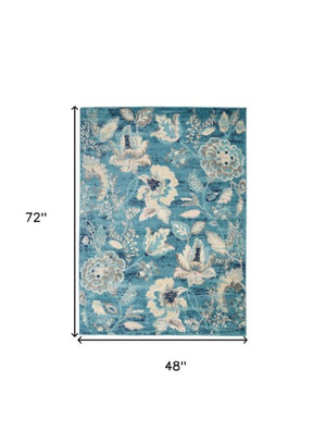 Homeroots 6' Stunning Turquoise Cream & Navy Floral Distressed Area Rug - Durable, Stain Resistant Design! 4' X 6' Polypropylene 553260