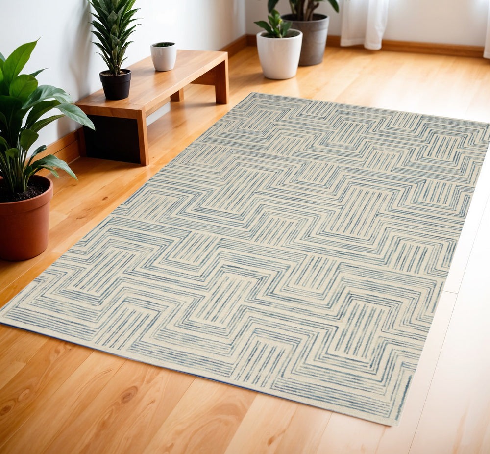 Homeroots 4' X 6' Ivory And Turquoise Wool Geometric Area Rug  Wool 553525