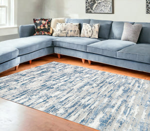 Homeroots 10' Blue And Ivory Abstract Washable Non Skid Area Rug  Polyester 553762