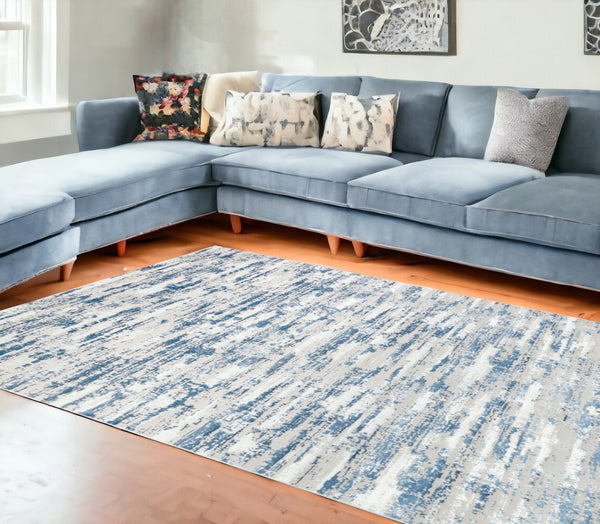 Homeroots 10' Blue And Ivory Abstract Washable Non Skid Area Rug  Polyester 553762