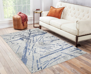 Homeroots 5' X 8' Ivory And Blue Abstract Area Rug  Polyester 553855
