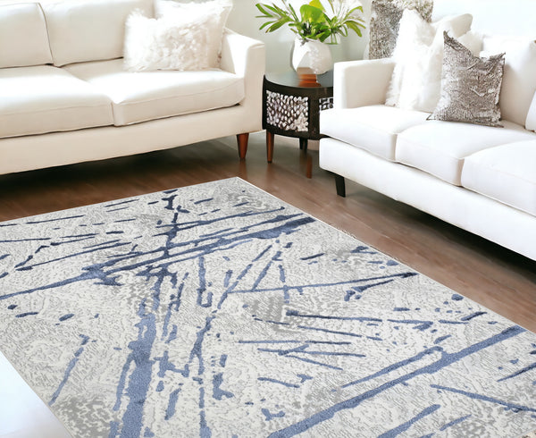 Homeroots 8' X 11' Ivory And Blue Abstract Area Rug  Polyester 553856
