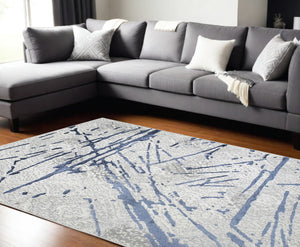 Homeroots 9' X 12' Ivory And Blue Abstract Area Rug  Polyester 553857