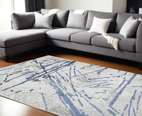 Homeroots 9' X 12' Ivory And Blue Abstract Area Rug  Polyester 553857