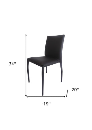 HomeRoots Set of Four Stylish Black Faux Leather Dining Chairs – Contemporary, Stackable, and Versatile Design 553975