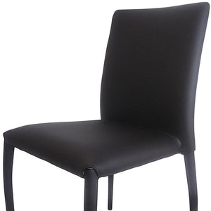 HomeRoots Set of Four Stylish Black Faux Leather Dining Chairs – Contemporary, Stackable, and Versatile Design 553975