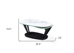 HomeRoots 36" Stylish White & Black Faux Marble Oval Coffee Table with Geometric Metal Base for Modern Living 554270