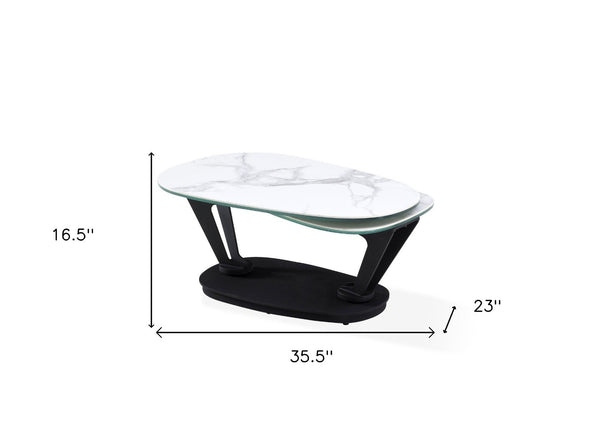 HomeRoots 36" Stylish White & Black Faux Marble Oval Coffee Table with Geometric Metal Base for Modern Living 554270