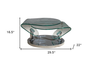 Homeroots 30" Clear Glass And Silver Metal Oval Abstract Coffee Table - Stylish Accent For Living Spaces   554294