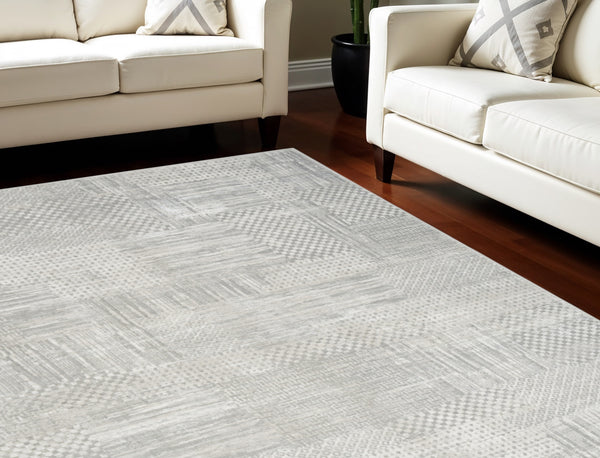 Homeroots 9' X 12' Ivory Silver And Gray Abstract Non Skid Area Rug  Polyester 554725