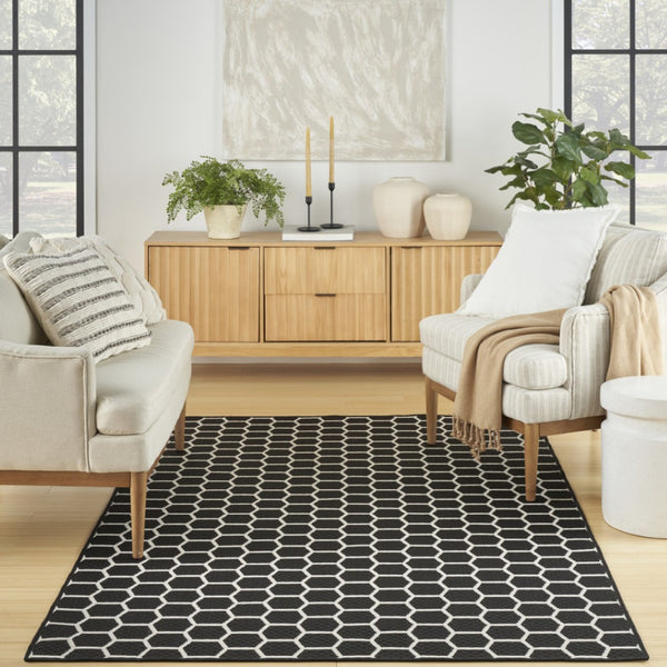 HomeRoots 6' X 9' Black and Ivory Geometric Area Rug - Versatile Indoor/Outdoor Design for Modern Spaces 554832
