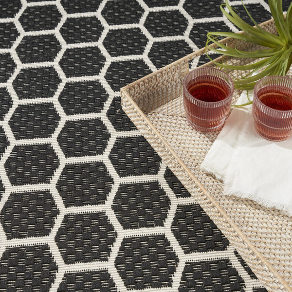 HomeRoots 6' X 9' Black and Ivory Geometric Area Rug - Versatile Indoor/Outdoor Design for Modern Spaces 554832