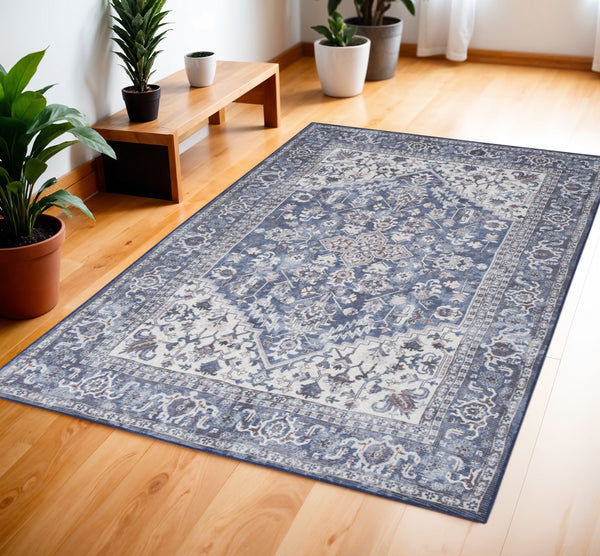 Homeroots 4' X 6' Blue And Ivory Floral Medallion Power Loom Distressed Area Rug  Cotton Blend 554849