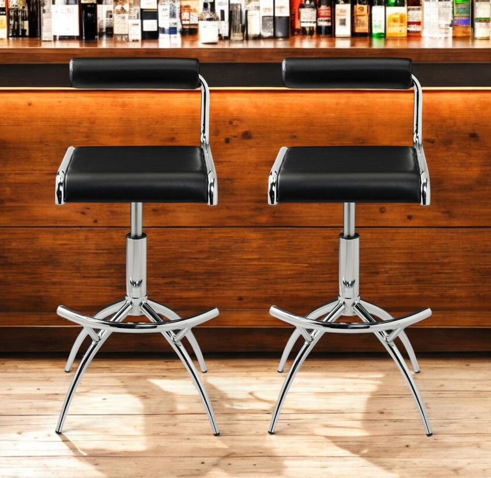 HomeRoots Set of Two Stylish Black and Silver Faux Leather Bar Chairs with Adjustable Height & Footrest 555023