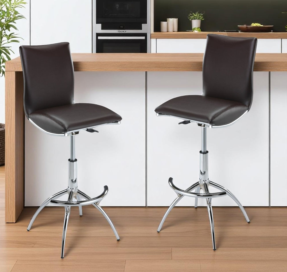 HomeRoots Set of Two Stylish Brown Faux Leather Adjustable Bar Chairs with Silver Metal Frame for Modern Spaces 555025