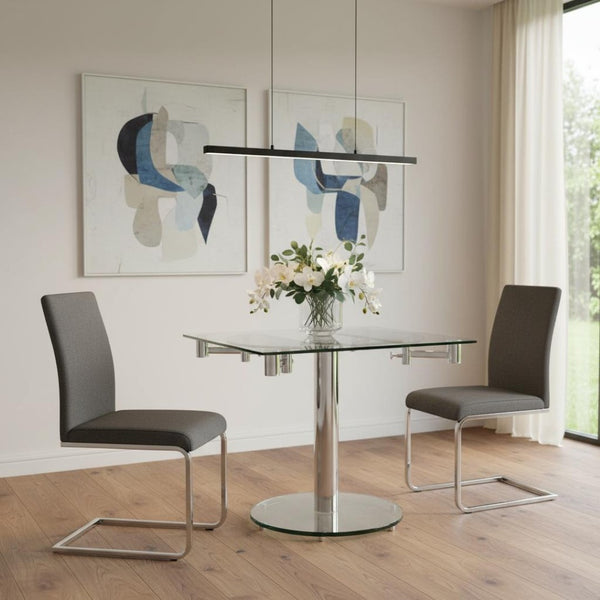 HomeRoots 50" Clear Glass and Silver Metal Dining Table with Self-Storing Leaf for Modern Elegance and Versatility 555157