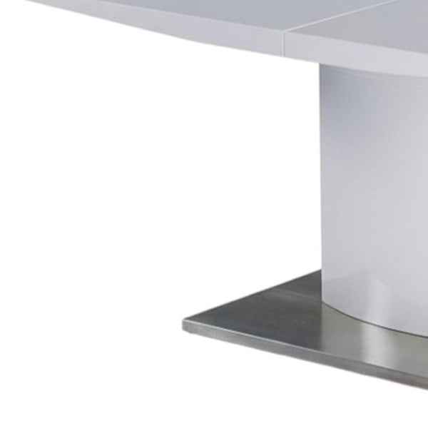HomeRoots 63" White Metal Pedestal Dining Table with Self-Storing Leaf - Modern, Stylish & Versatile Centerpiece 555173