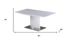 HomeRoots 63" White Metal Pedestal Dining Table with Self-Storing Leaf - Modern, Stylish & Versatile Centerpiece 555173