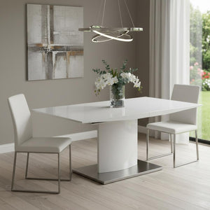 HomeRoots 63" White Metal Pedestal Dining Table with Self-Storing Leaf - Modern, Stylish & Versatile Centerpiece 555173