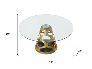 HomeRoots 48" Clear Glass and Gold Metal Pedestal Dining Table - Modern Glamour for Stylish Dining Spaces 555189