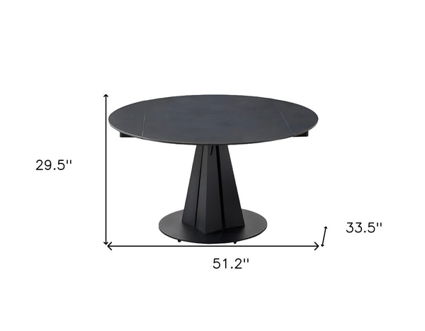 HomeRoots 51" Black Stone & Metal Round Extendable Dining Table with Self-Storing Leaf for Modern Spaces 555192