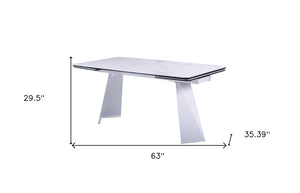 HomeRoots 63" White Ceramic Dining Table with Metal Base - Extendable & Elegant for Modern Gatherings! 555195