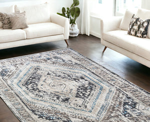 HomeRoots 5' Gray Beige and Blue Geometric Distressed Area Rug with Fringe for Vintage Charm and Durability 9' X 13' 555365