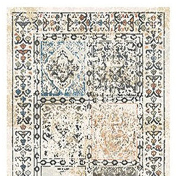 HomeRoots 8' Stylish Ivory Blue and Gray Distressed Patchwork Runner Rug with Fringe for Homes and Halls 555372