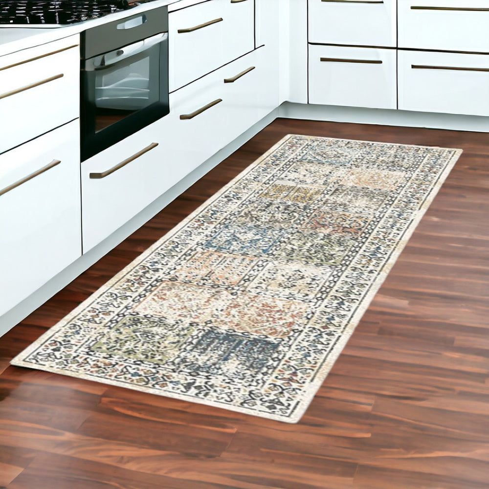 HomeRoots 8' Stylish Ivory Blue and Gray Distressed Patchwork Runner Rug with Fringe for Homes and Halls 555372