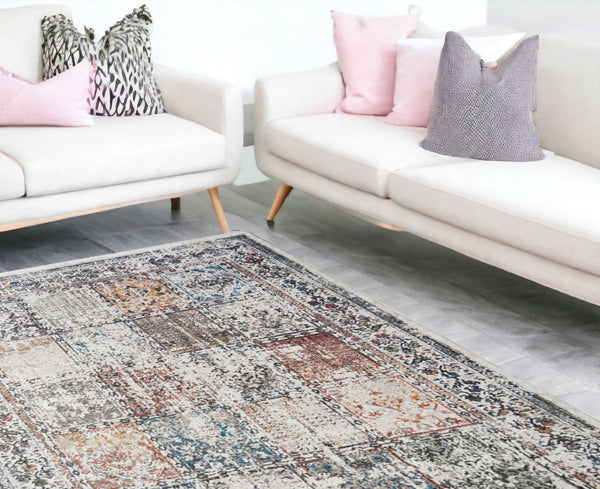 HomeRoots 5' Ivory Oriental Distressed Area Rug with Tasseled Fringe - Timeless Elegance for Any Room 9' X 13' 555375