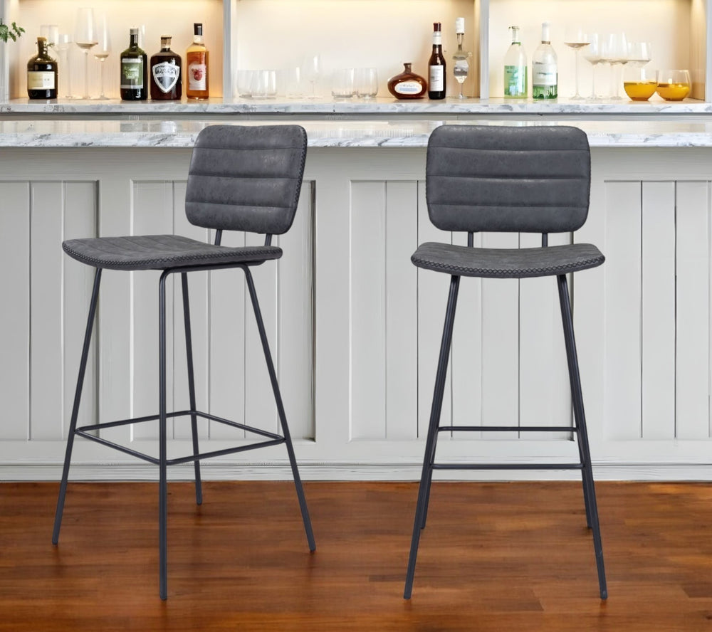 Homeroots Set Of Two 30" Black Faux Leather And Steel Low Back Bar Height Bar Chairs   555737