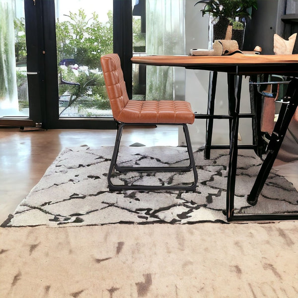 HomeRoots Set of Two Tufted Faux Leather Dining Chairs with Black Steel Legs - Modern Comfort & Style! 555792