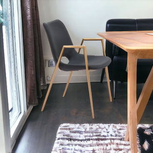 HomeRoots Set of Two Black & Gold Faux Leather Dining Arm Chairs - Modern Elegance & Comfort for Any Space 555802