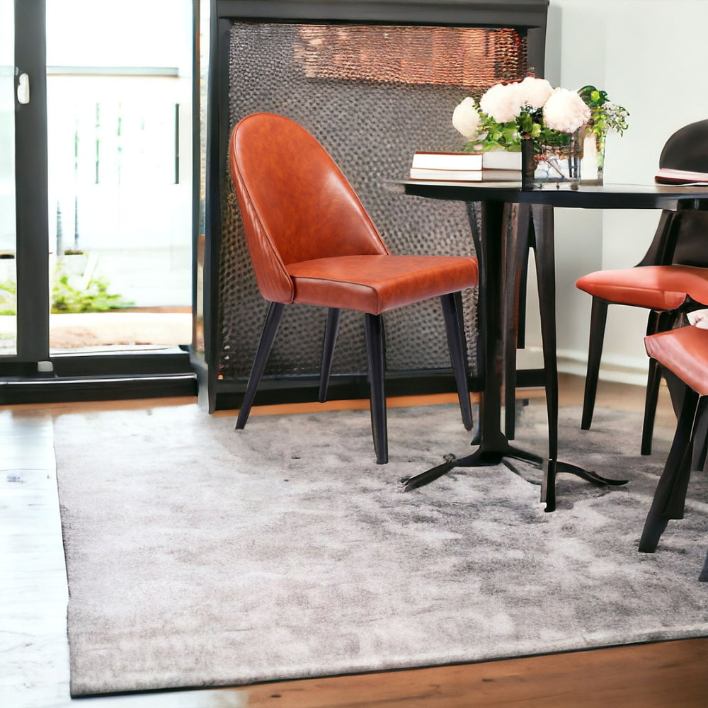 HomeRoots Set of Two Modern Brown and Black Upholstered Faux Leather Dining Side Chairs for Versatile Comfort 555835