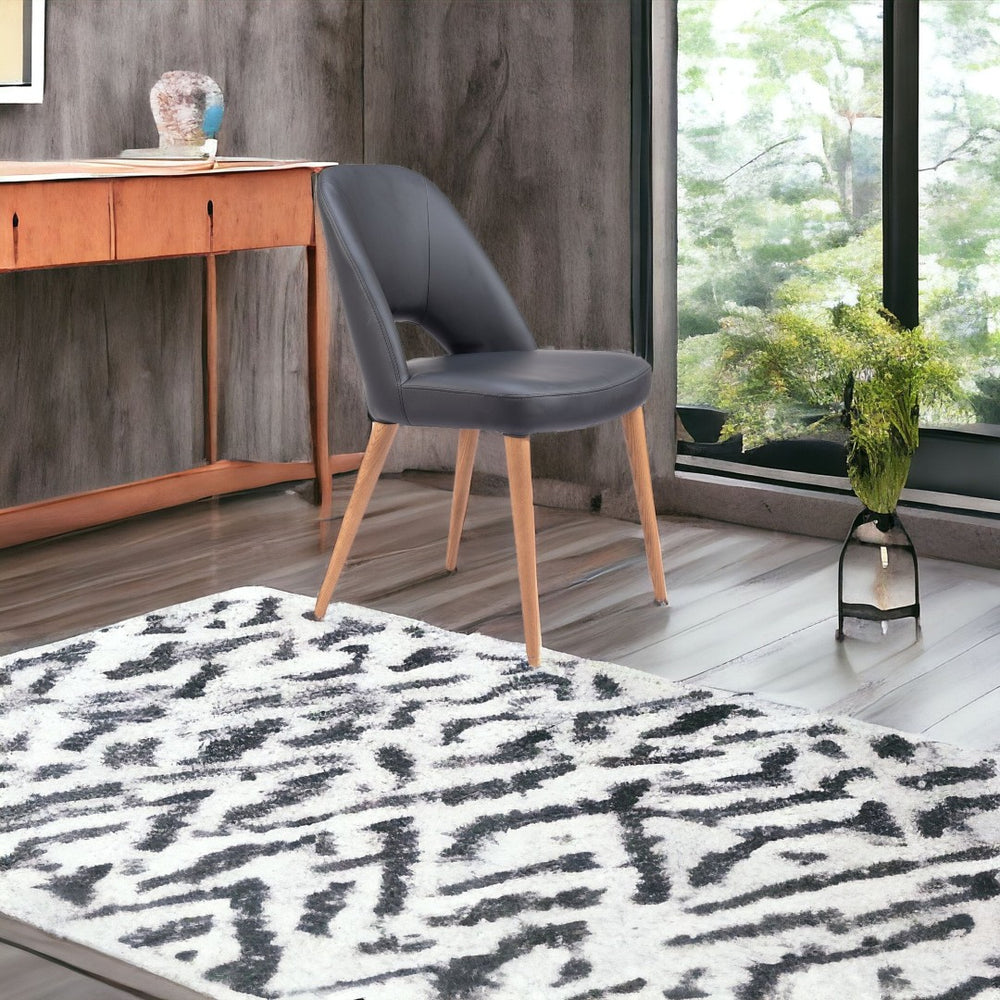 HomeRoots Set of Two Modern Open Back Faux Leather Dining Chairs - Stylish Comfort for Any Space 555849