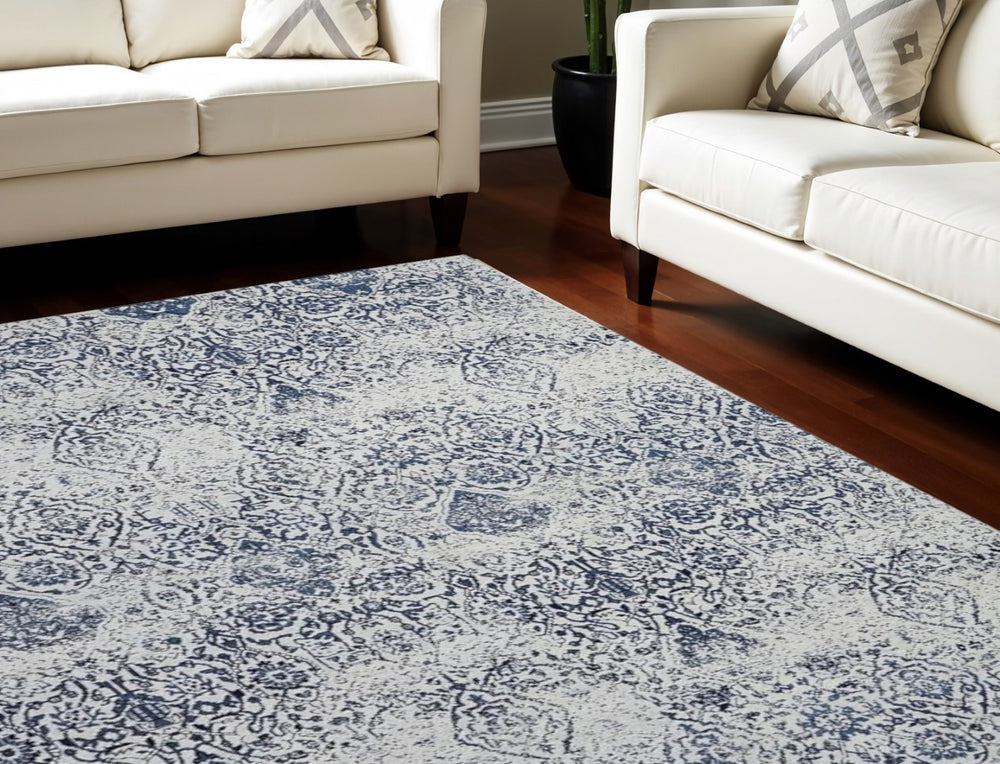 HomeRoots 8' Navy Blue and Ivory Damask Distressed Area Rug - Timeless Elegance for Any High-Traffic Space 8' X 10' 556095