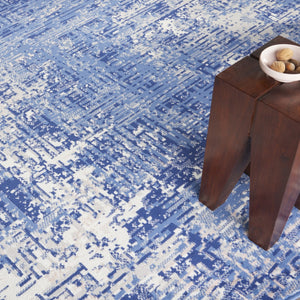 HomeRoots 8' Abstract Distressed Ivory and Blue Area Rug - Modern, Durable, Stain-Resistant Design for Any Space 8' Round 556172