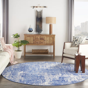 HomeRoots 8' Abstract Distressed Ivory and Blue Area Rug - Modern, Durable, Stain-Resistant Design for Any Space 8' Round 556172