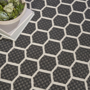HomeRoots 8' Black and Ivory Geometric Rug - Durable, Reversible, Modern Design for Indoor & Outdoor Spaces 556309