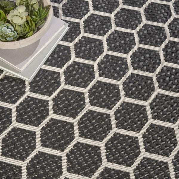 HomeRoots 8' Black and Ivory Geometric Rug - Durable, Reversible, Modern Design for Indoor & Outdoor Spaces 556309