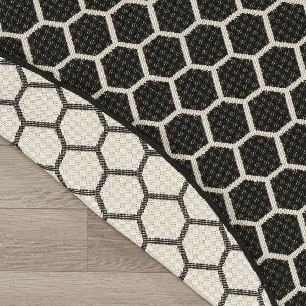 HomeRoots 8' Black and Ivory Geometric Rug - Durable, Reversible, Modern Design for Indoor & Outdoor Spaces 556309