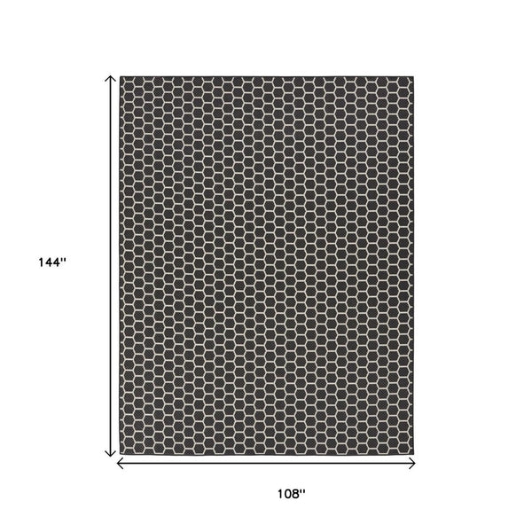 HomeRoots 9' X 12' Black and Ivory Geometric Rug – Versatile Indoor/Outdoor Flatwoven Design for Modern Spaces 556311