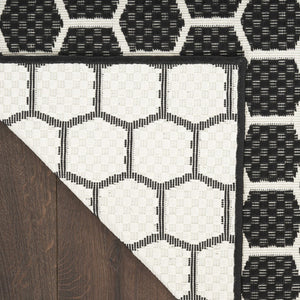 HomeRoots 9' X 12' Black and Ivory Geometric Rug – Versatile Indoor/Outdoor Flatwoven Design for Modern Spaces 556311