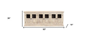 HomeRoots 93" Antiqued White Distressed Sideboard with Glass Doors - Coastal Charm & Timeless Craftsmanship! 557697
