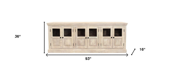 HomeRoots 93" Antiqued White Distressed Sideboard with Glass Doors - Coastal Charm & Timeless Craftsmanship! 557697