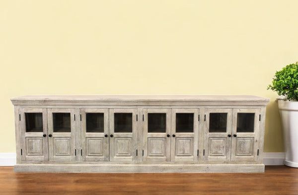 Homeroots 118" White Solid Wood Distressed Sideboard - Coastal Charm With 8 Glass Doors & Antique Hardware   557698